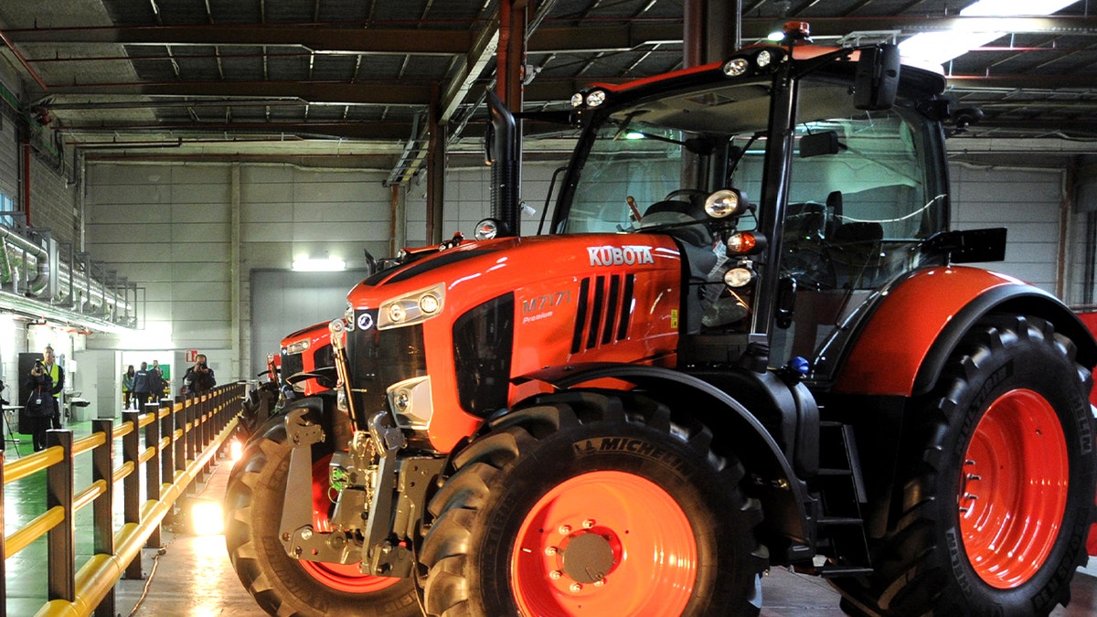 an orange tractor inside facility