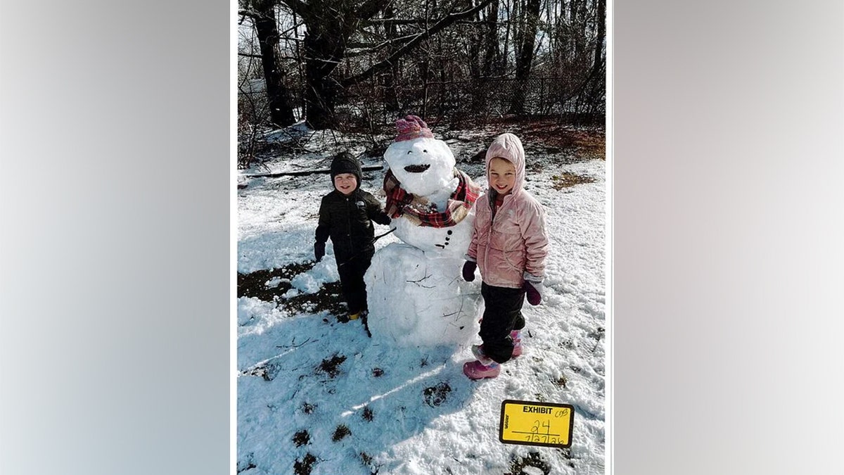 two kids with snowman