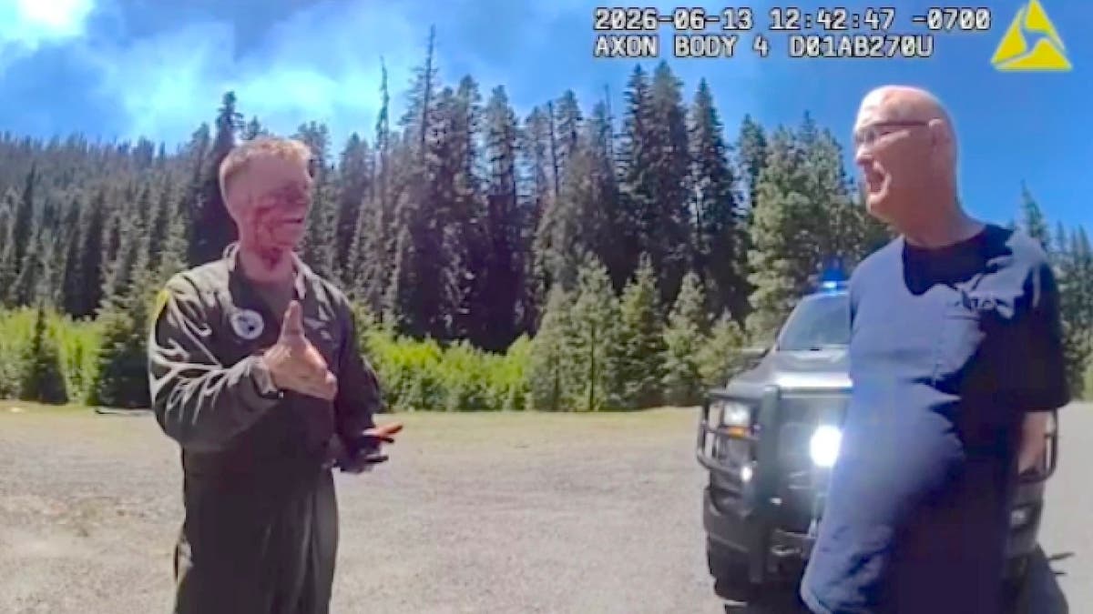Major Jackson Simon with a bystander