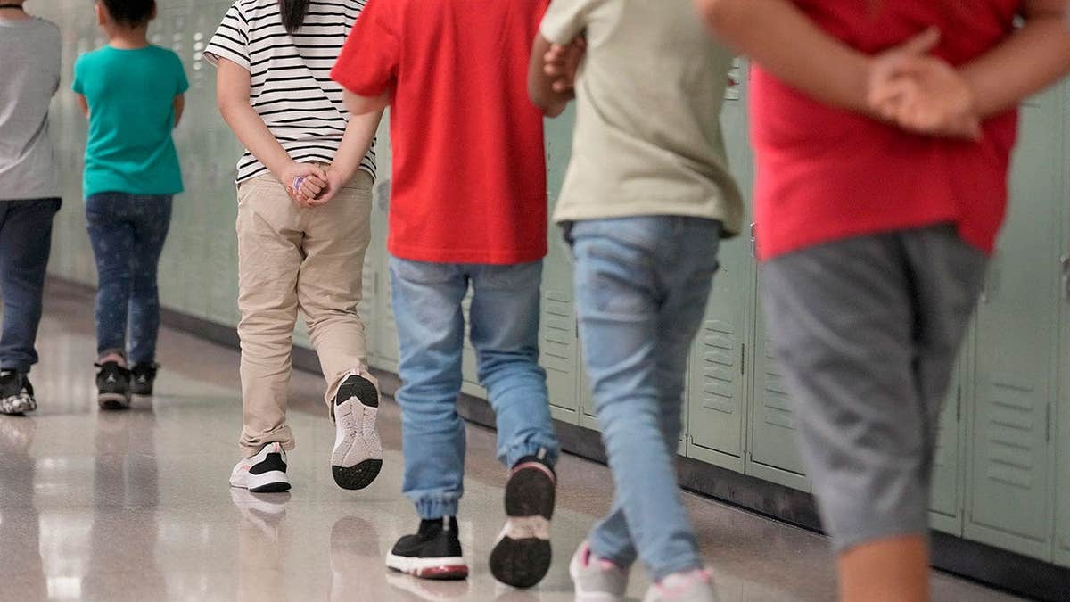 Students walk at Meyer Elementary School in Richmond, Texas.
