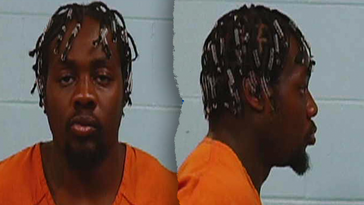 Benedict Ogbodiegwu wearing an orange shirt, with a goatee and braided hair in his mugshot