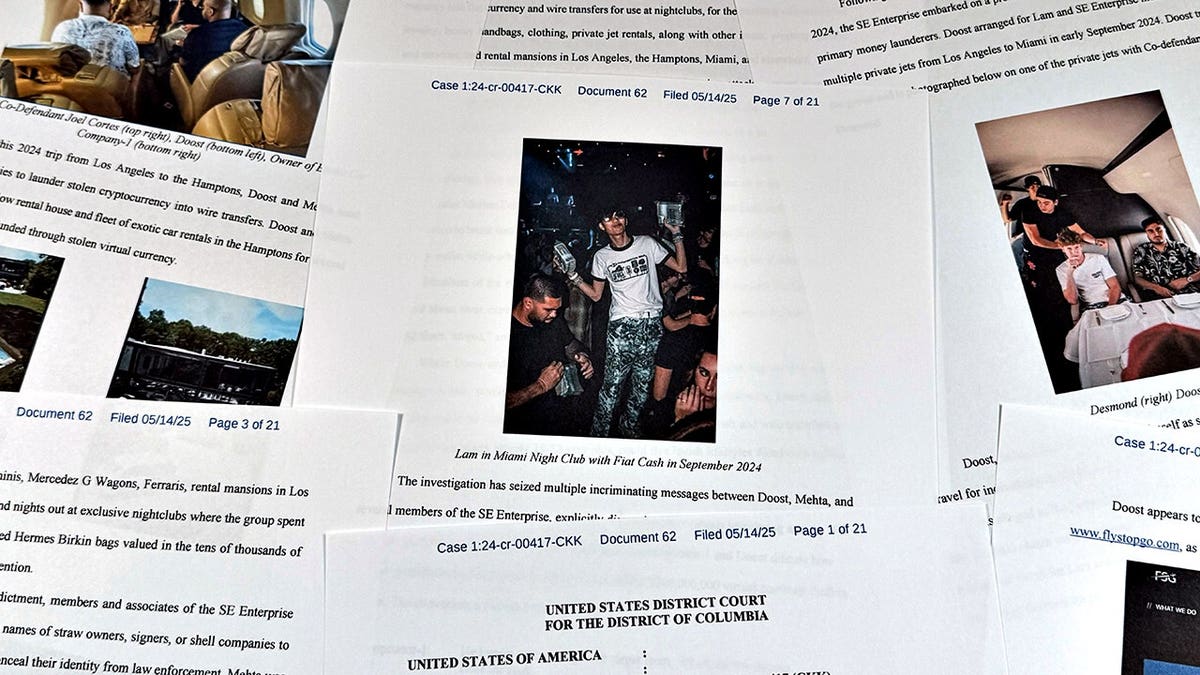 A Justice Department court filing against Hamza Doost and Kunal Mehta lies on a surface.