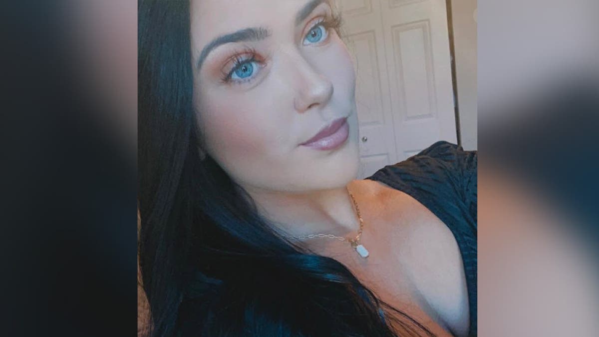 image shows Hannah taking a selfie