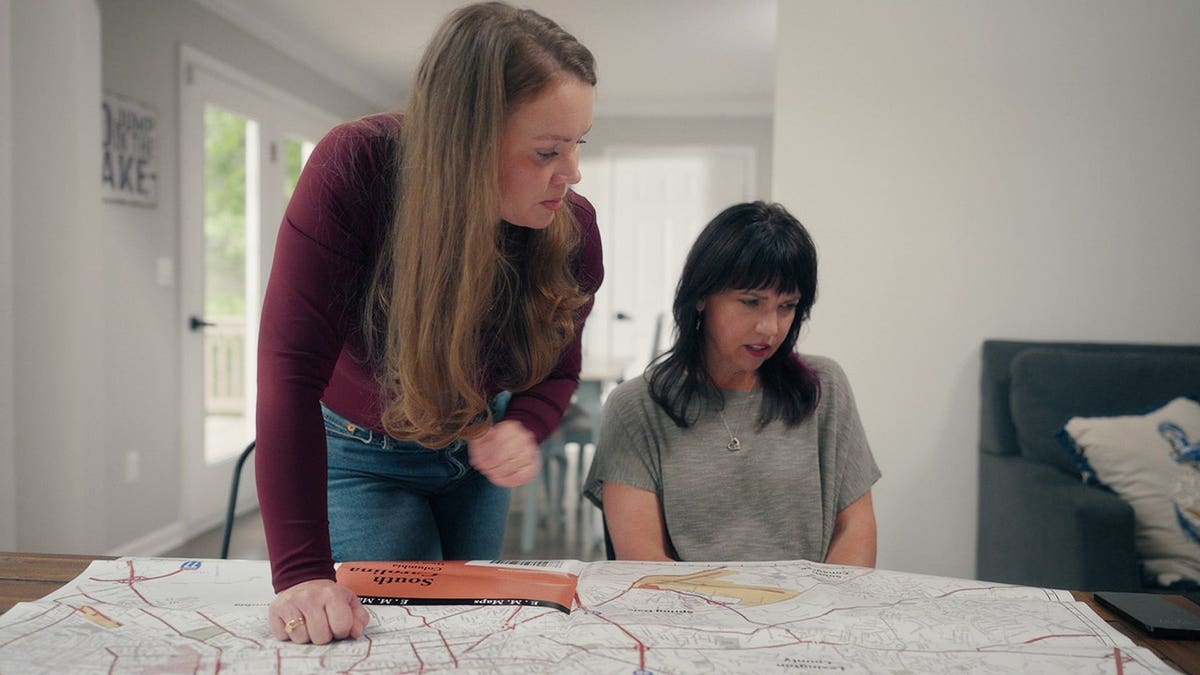 Kara Robinson Chamberlain and Bonnie Lou Gower looking at a map.