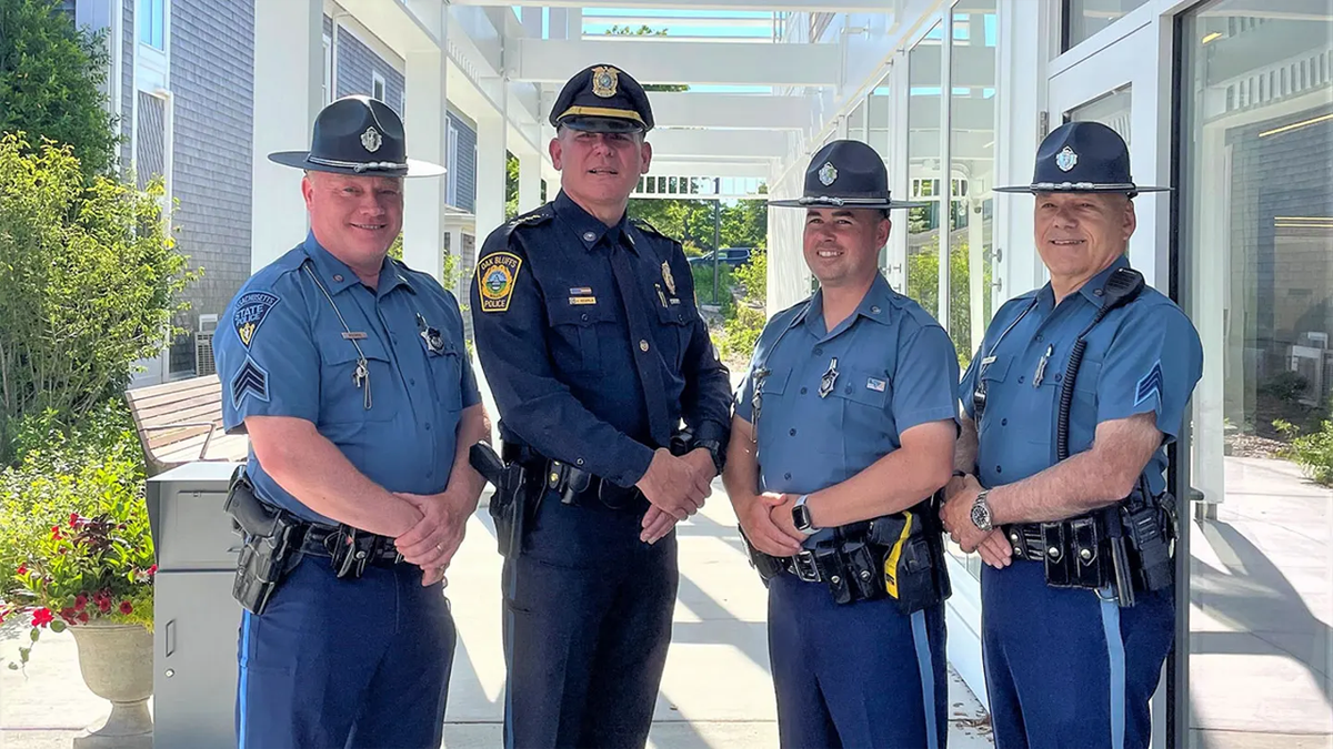 Oak Bluffs Police Chief Jonathan Searle stands with Massachusetts State Police officer