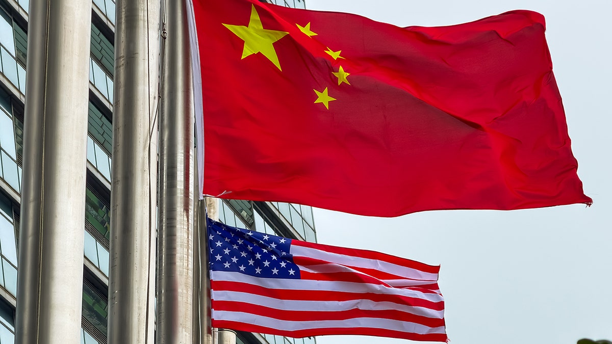 Chinese and US flags fly in Hong Kong