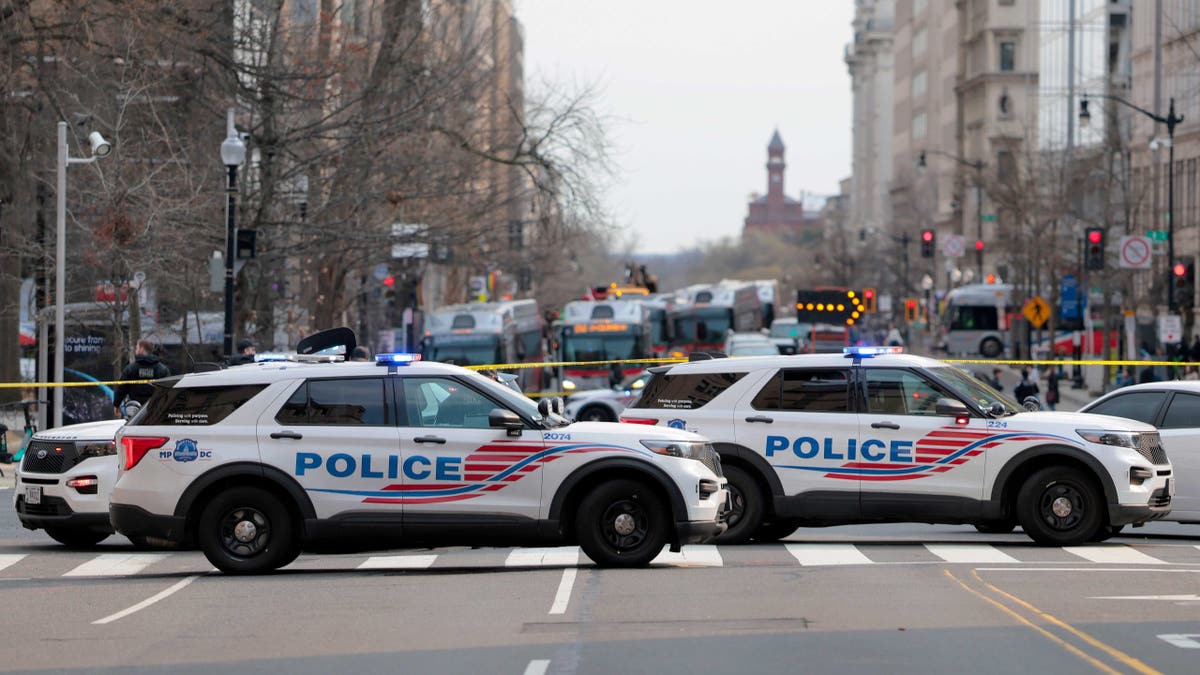Members of D.C. Metropolitan Police respond to reports of a bomb threat near One Franklin Square on March 13, 2026 in Washington, D.C.