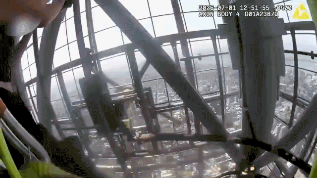 NYPD bodycam shows officers confronting an unharnessed couple atop a New York City skyscraper.