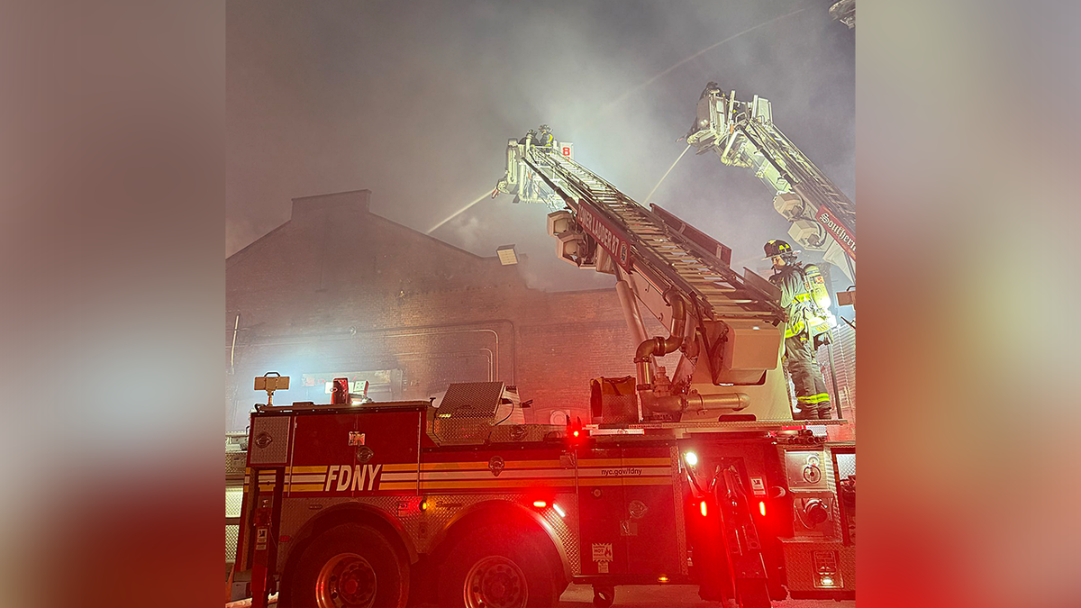 Fire crews work to put out a fire in NYC
