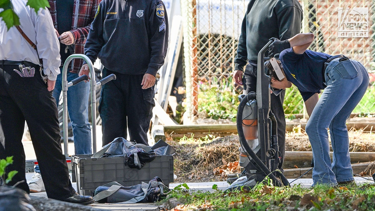 FBI agents bring out a vaccum cleaner as they search for evidence in the home of Eugene Horsch on West Chew Avenue in Philadelphia on Monday, Oct. 5, 2026. Authorities are investigating the property after linking it to at least seven missing women. Eugene Horsch is the son of the late Raymond 