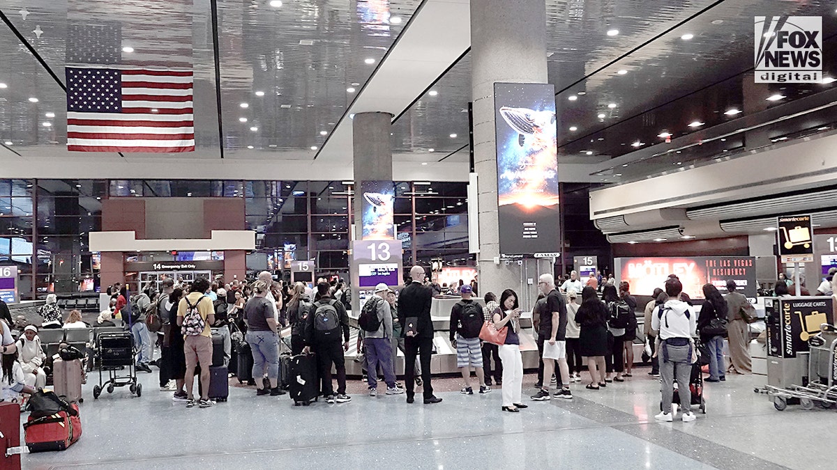 Tourists at luggage carousel at airport in Las Vegas.
