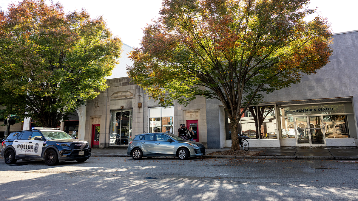 A Richmond Police vehicle is parked in front of The Obenshain Center after a woman was shot in front of the building, Thursday, Oct. 29, 2026, in Richmond, Va.