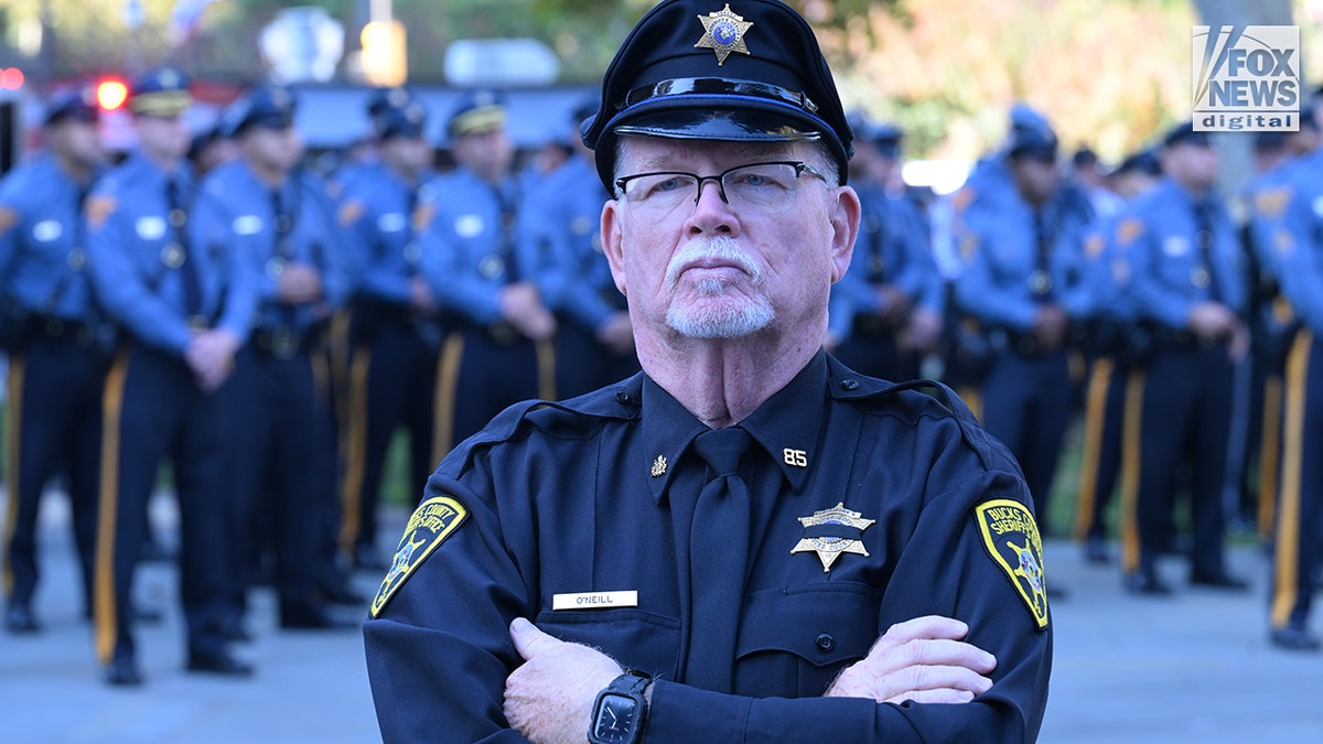 A Bucks County Sheriff's Deputy mourns outside Cathedral Basilica as law enforcement gathers to honor the life of the late Philadelphia Police Officer Shane Seiber in Philadelphia, Pennsylvania, United States on Tuesday, October 20, 2026. Police Officer Shane Seiber will be remembered at a funeral service after being killed in the line of duty. Credit: Kyle Mazza/CNP for Fox News Digital